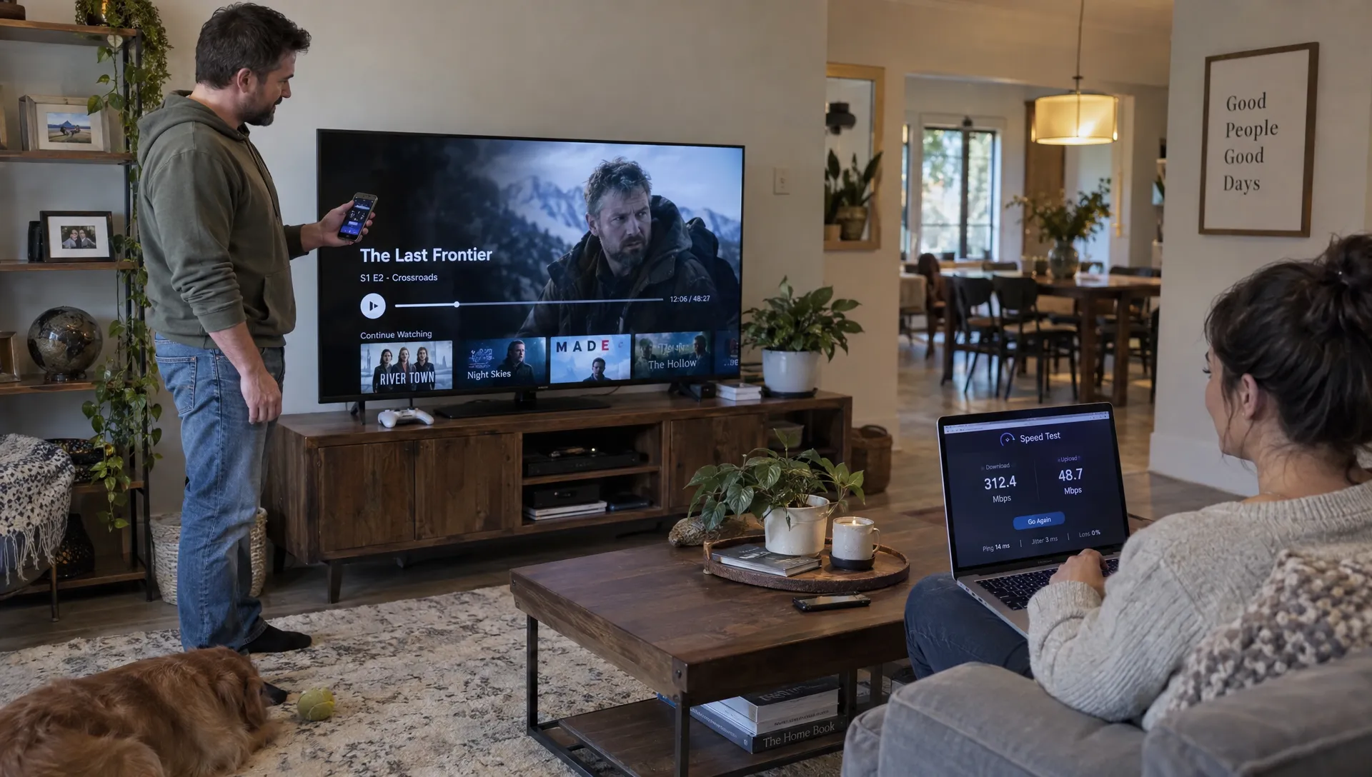 Two adults compare a paused IPTV stream on a television with a speed test on a laptop.