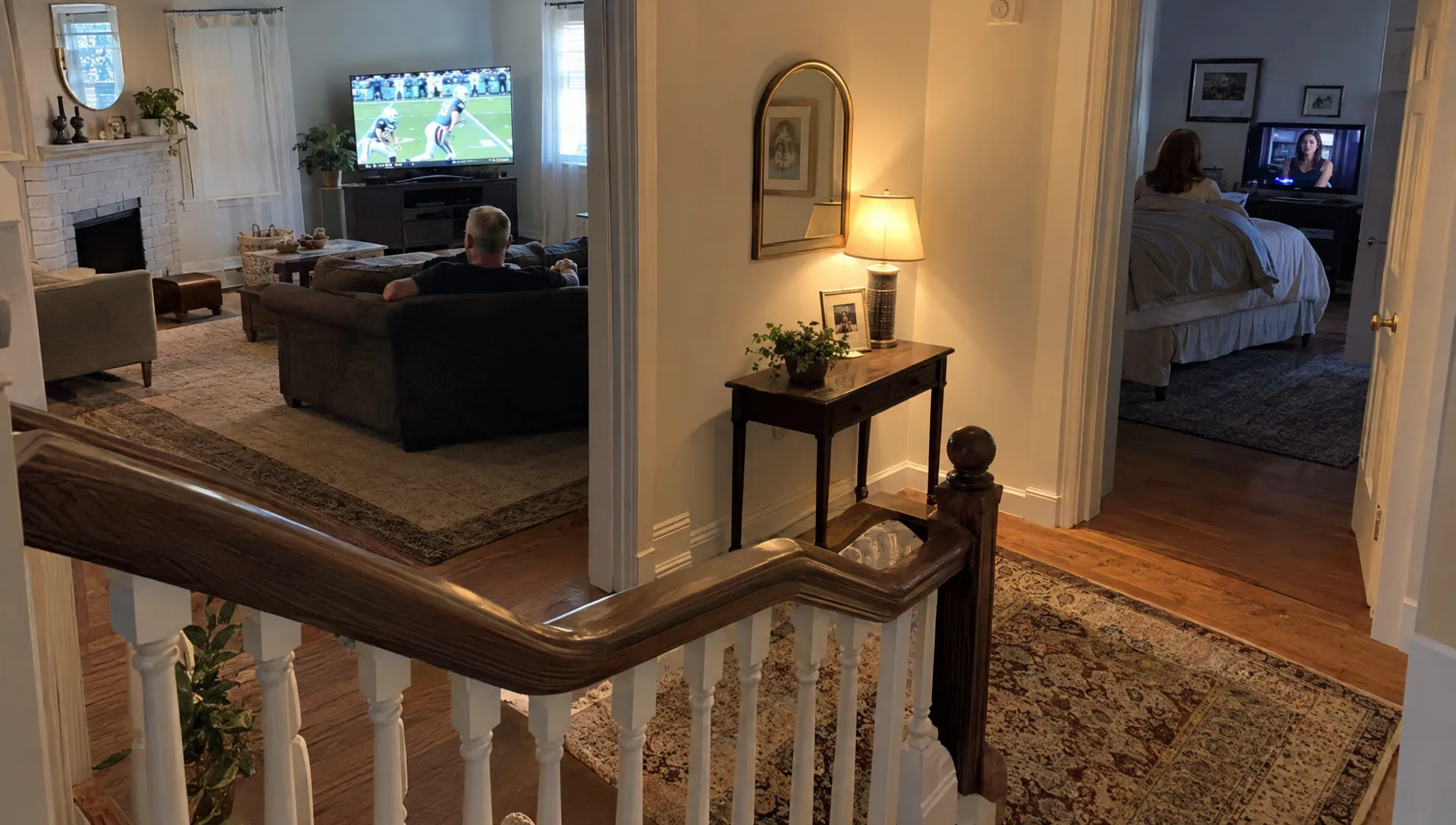 Two people watch different programs in separate rooms, showing how a household may use multiple IPTV streams at once.
